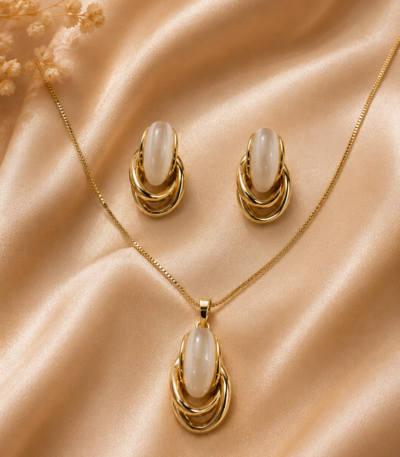 Sculpted pendant with matching earrings